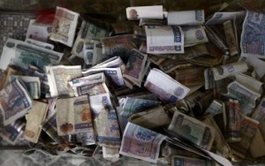 Myanmar's kyat banknotes are seen in a donation box of Sule Pagoda in Yangon July 21, 2011