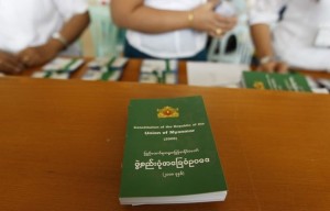 Staff sell copies of Myanmar's constitution at the Lower House of Parliament in Naypyitaw