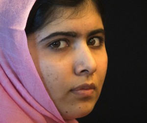 Yousafzai sits on the sidelines of a news conference convened by 'A World at School' in New York