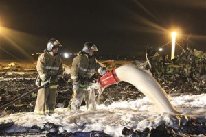 Handout photo of Russian Emergencies Ministry members and firefighters working at the site of a Tatarstan Airlines Boeing 737 crash at Kazan airport