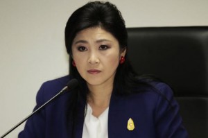 Prime Minister Yingluck Shinawatra attends her cabinet economic meeting at the office of the Permanent Secretary of Defense in Bangkok