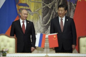Russia's President Putin and China's President Xi Jinping attend a signing ceremony in Shanghai
