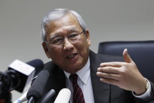 Thailand's interim prime minister Niwatthamrong Boonsongphaisan gestures during a news conference at the Permanent Secretary of Defence in Bangkok