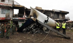 Security personnel secure scene where a cargo plane crashed into a commercial building at Utawala estate on outskirts of Kenya's capital Nairobi