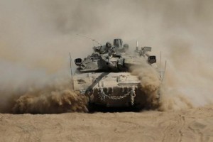 An Israeli tank manoeuvres outside the northern Gaza Strip