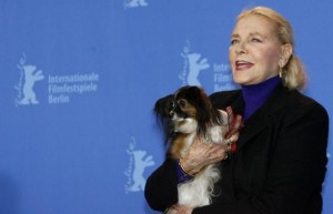 File photo of U.S actress Lauren Bacall posing with her dog Sophie during a photocall to present her film "The Walker" at the 57th Berlinale International Film Festival in Berlin