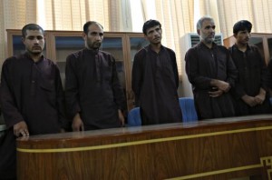 Five of seven men convicted of raping and robbing appear at a court in Kabul