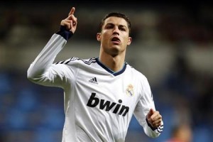 Real Madrid's Cristiano Ronaldo celebrates after scoring his second goal against Sevilla during their Spanish first division soccer match in Madrid