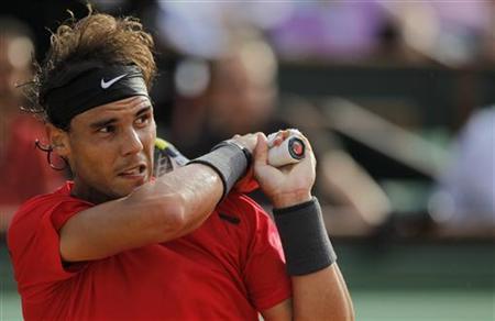 Nadal of Spain returns the ball to Schwank of Argentina during the French Open tennis tournament at the Roland Garros stadium in Paris