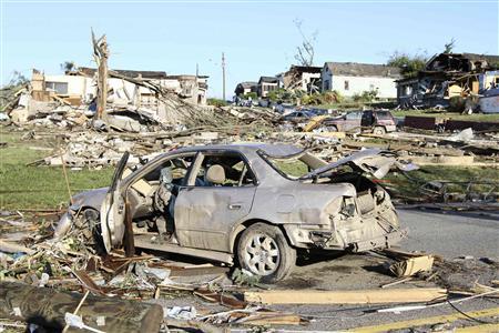 The aftermath of overnight tornadoes show destroyed homes and vehicles in Pratt City