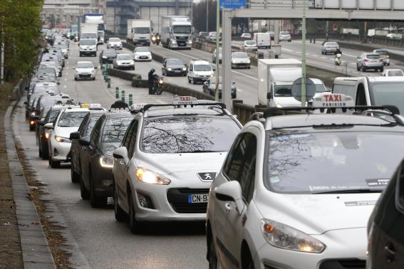 Striking Paris taxis take part in a demonstration over the Paris ring road