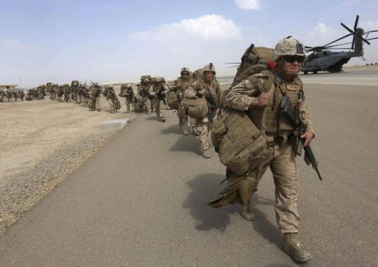 U.S. Marines prepare to depart upon the end of operations for Marines and British combat troops in Helmand