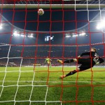 Bayern Munich's Neuer hits the post and misses as he takes a penalty after extra time in German Cup semi-final soccer match against Borussia Dortmund in Munich