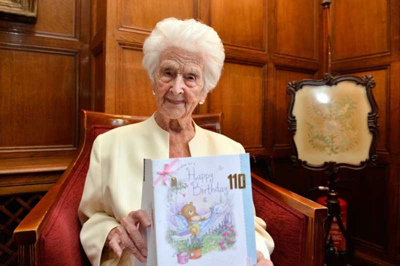 Grace Jones, ditches the whisky for the day to celebrate her 110th birdthday with a glass of champagne. One of Britain's oldest women celebrated her 110th birthday yesterday (Fri) - and revealed the secret to her long life is a daily tot of WHISKY. See NTI story NTIOLD. Grace Jones, known to her friends as "Amazing Grace", is the 10th oldest person in the UK. Yesterday she turned 110 and said her longevity is down to having had a night-cap of Famous Grouse single malt whisky every evening for the last 60 years. Liverpudlian Mrs Jones was born on September 16, 1906 - five years after the death of Queen Victoria. She has lived through 27 prime ministers, received seven telegrams from the Queen and survived two world wars. The mother-of-one, who lives in Broadway, Worcs., said: "I never miss my night cap. All I have is the whisky at night. "Whisky is very good for you. I started having a nightly tot of it when I turned 50 so I've been having it every night for the last 60 years and I certainly have no intention of stopping now.î
