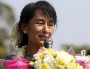 Myanmar's opposition leader Aung San Suu Kyi speaks to supporters from a vehicle at Yae Phyu village in Dawei township