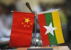 Myanmar and Chinese national flags are seen on a table during the opening ceremony of opening office of Pyithau Hluttaw Commission for Assessment of Legal Affairs and Special Issues office, in Yangon